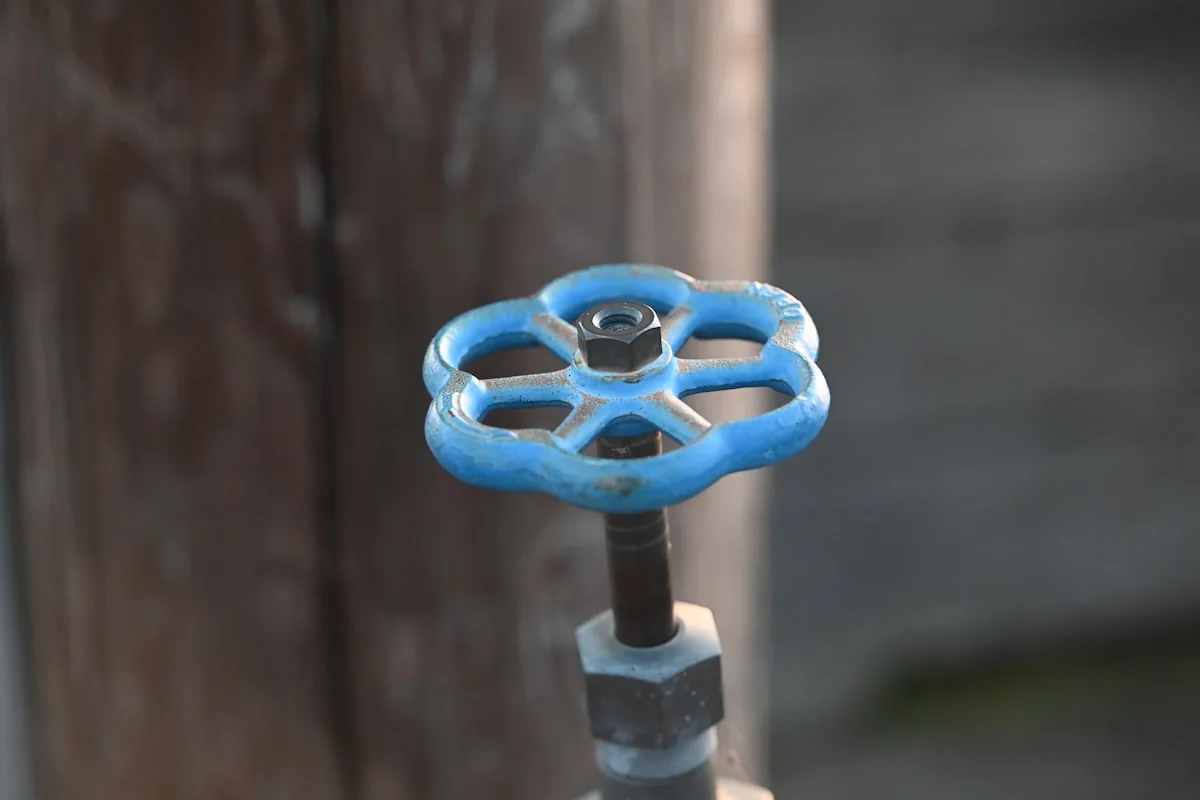Detail of a blue water valve handle
